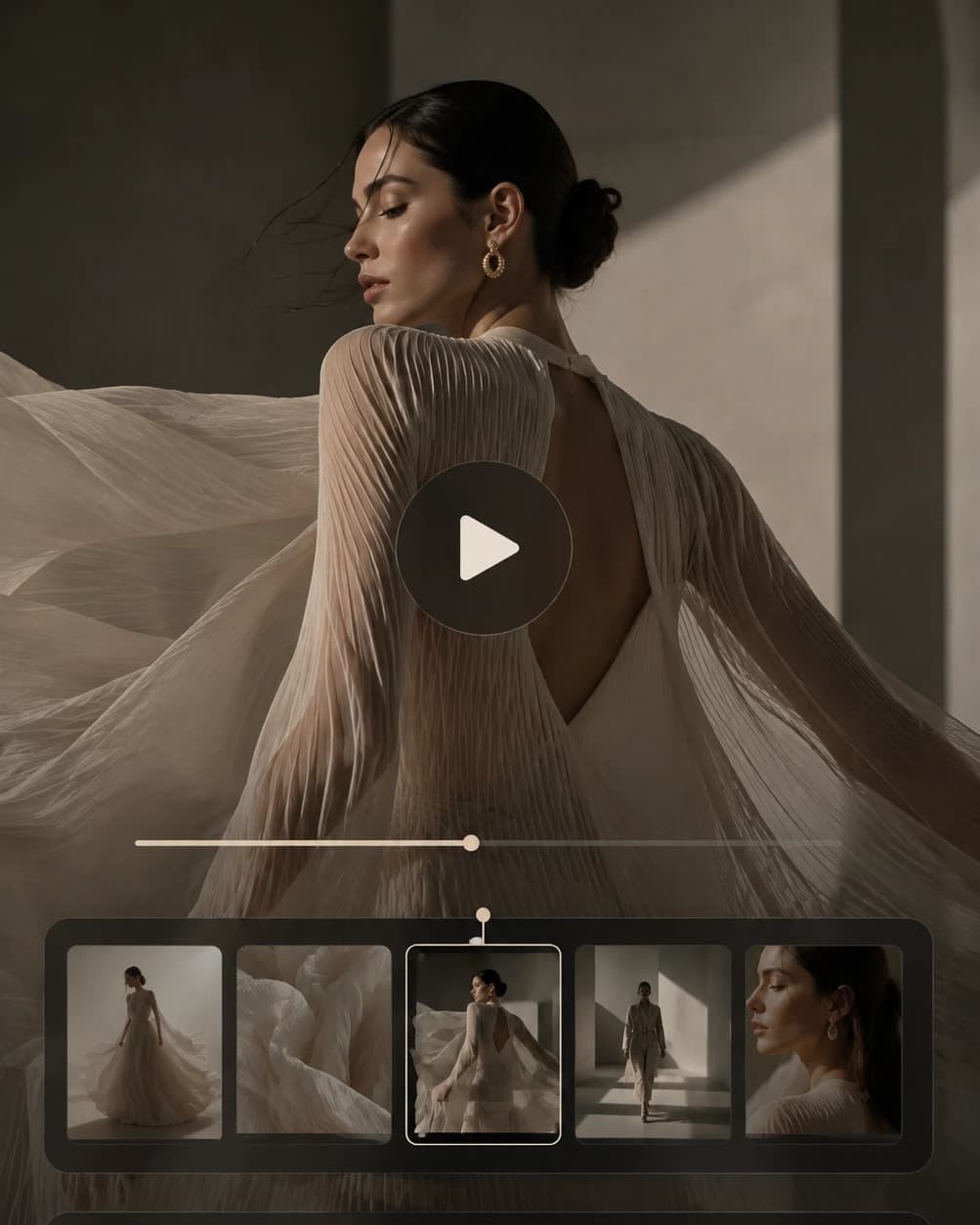 A frame from a generated fashion film - a figure in a pleated gown mid-turn, sunlight raking across a stone hall - with a play head over it, a scrubber under it and five frames of the same clip laid out along the bottom