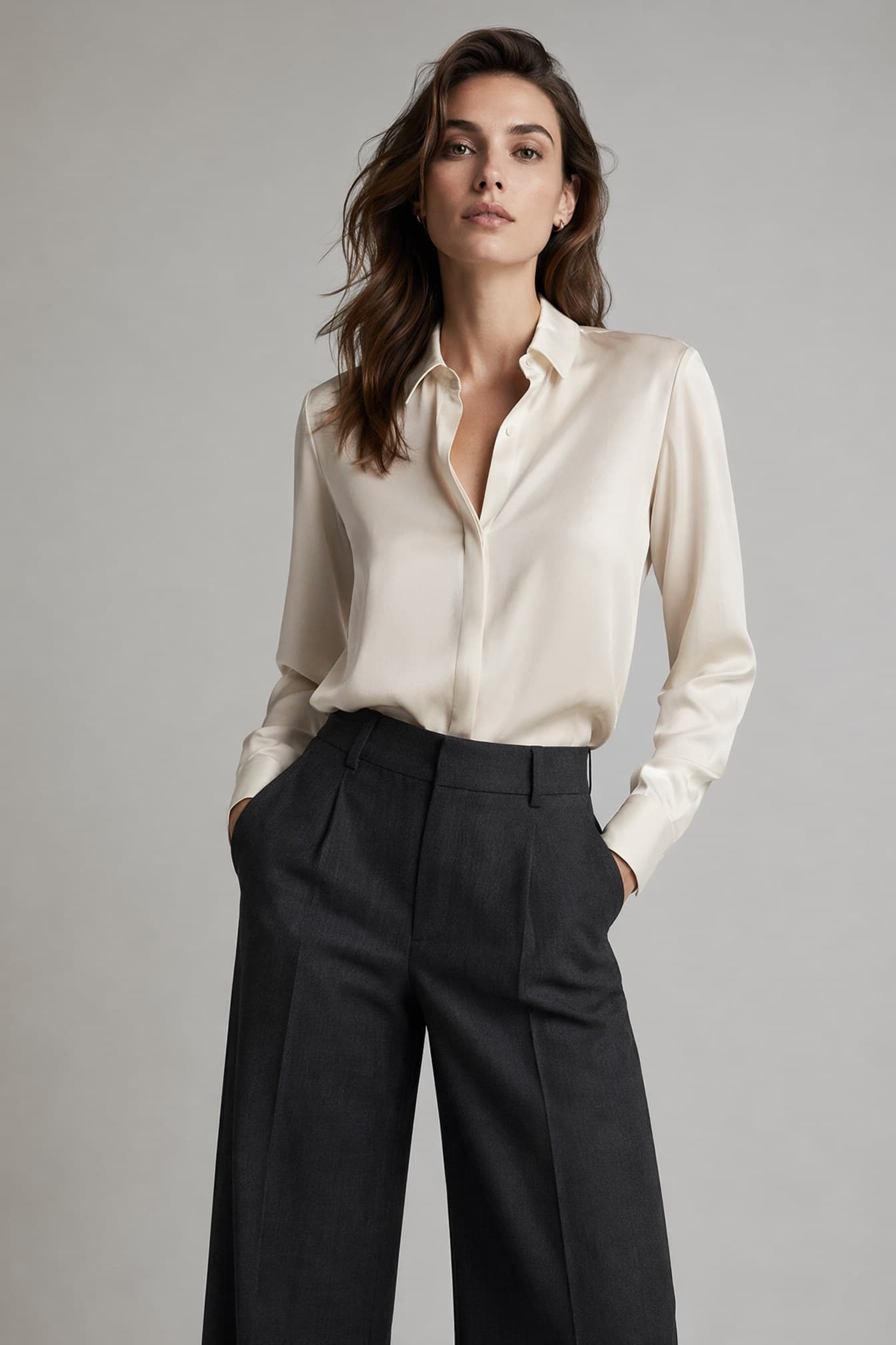 Dark wavy hair · ivory shirt