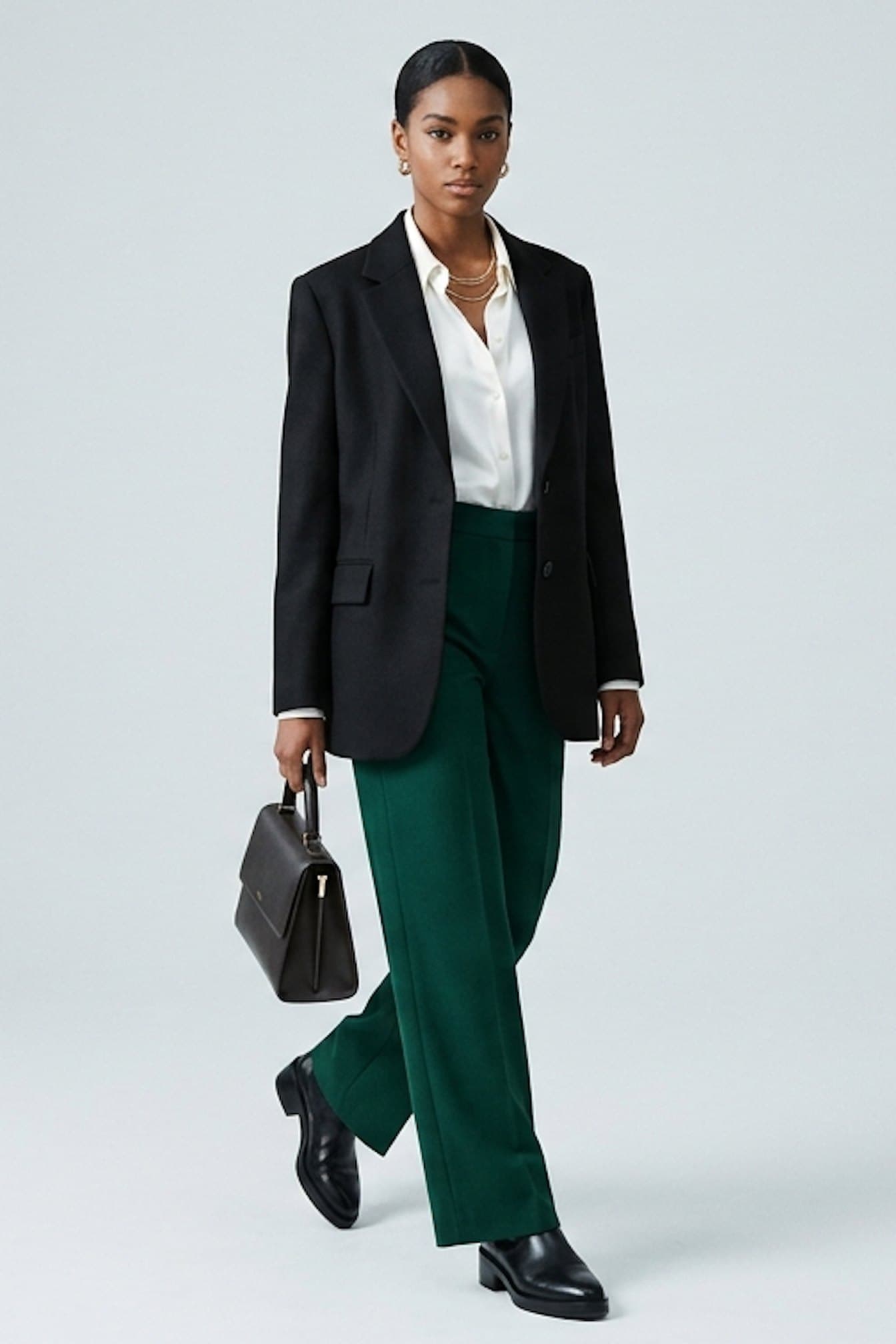 Black · sleek bun, black blazer + green